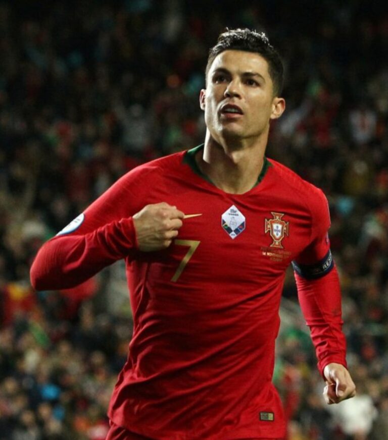 Christiano Ronaldo wearing his red Portugal Jersey bearing a number seven.